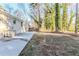 This backyard features a large concrete patio and a spacious yard at 2080 Dellwood Pl, Decatur, GA 30032