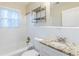 This bathroom features a shower and tub combination, and a granite countertop at 2080 Dellwood Pl, Decatur, GA 30032