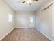 This bedroom features neutral carpeting, a window and a door to the exterior of the home at 2080 Dellwood Pl, Decatur, GA 30032