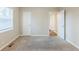 This bedroom features neutral carpeting, neutral walls, and a large window at 2080 Dellwood Pl, Decatur, GA 30032