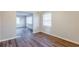 Open-concept dining room that leads into the living room, complete with hardwood floors at 2080 Dellwood Pl, Decatur, GA 30032
