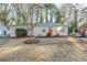 Charming one-story home with an orange front door, complemented by a well-maintained front yard at 2080 Dellwood Pl, Decatur, GA 30032