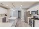 Well-appointed kitchen showcasing stainless steel appliances, a functional island, and white cabinetry at 608 Sweetfern Ln, Sugar Hill, GA 30518