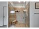 Beautiful glass enclosed shower with built in bench and tiled walls at 7890 Bristol Valley Dr, Cumming, GA 30028