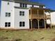 White two-story home featuring a spacious porch, multiple windows, and newly installed sod at 2021 Shallowford Rd, Marietta, GA 30066
