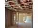 Unfinished basement displaying wooden framing, exposed insulation, and ductwork at 2021 Shallowford Rd, Marietta, GA 30066