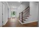 Inviting foyer with hardwood floors, staircase, and a view to the outdoors at 2021 Shallowford Rd, Marietta, GA 30066