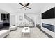 Living room featuring a large rug, modern fireplace, and comfortable seating at 2890 Longbush Lane, Duluth, GA 30097