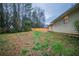 The backyard is mostly grass with a full wooden fence at 5087 Donnell Way, Decatur, GA 30035