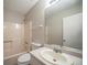 This bathroom features a shower-tub combo with a single vanity and a large mirror at 5087 Donnell Way, Decatur, GA 30035