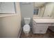Bathroom featuring a toilet, a vanity with drawers and a bathtub in mirror reflection at 5087 Donnell Way, Decatur, GA 30035
