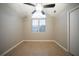 Bedroom features a ceiling fan, vaulted ceiling and natural light from the window at 5087 Donnell Way, Decatur, GA 30035
