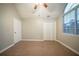 Bedroom featuring a ceiling fan, natural light from the window, and tile flooring at 5087 Donnell Way, Decatur, GA 30035