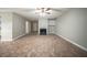 Expansive living area with tile floors, a fireplace, and neutral paint providing a warm and inviting ambiance at 5087 Donnell Way, Decatur, GA 30035