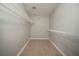 A large walk-in closet featuring tiled flooring and metal shelves at 5087 Donnell Way, Decatur, GA 30035