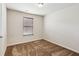 Small bedroom with window, neutral carpet, and good light at 2293 Chancery Mill Ln, Buford, GA 30519