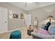 Bedroom with a daybed, tropical-themed decor, and natural light from a window at 236 Balaban Cir, Woodstock, GA 30188