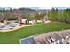 Beautiful aerial view of the community pool, clubhouse, and surrounding landscaping at 236 Balaban Cir, Woodstock, GA 30188