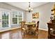 Bright dining area with hardwood floors, chandelier, and access to the backyard at 236 Balaban Cir, Woodstock, GA 30188