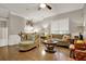 Comfortable living room with hardwood floors, ceiling fan, and natural light at 236 Balaban Cir, Woodstock, GA 30188