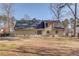 Exterior view of the home's backyard with a patio and lawn at 4808 Sunview Ct, Suwanee, GA 30024