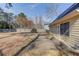 View of the backyard with a concrete patio and partially fenced yard at 4808 Sunview Ct, Suwanee, GA 30024