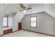 Carpeted bedroom offers built-in shelving and multiple windows for ample natural light at 4808 Sunview Ct, Suwanee, GA 30024