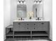 Gray double vanity with black hardware, white countertop and tile flooring at 770 Waters Sw Dr, Atlanta, GA 30310