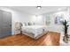 Bright bedroom with a large bed, hardwood floors, and neutral decor with a window view at 770 Waters Sw Dr, Atlanta, GA 30310