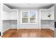 Walk-in closet with custom shelving and hardwood floors at 770 Waters Sw Dr, Atlanta, GA 30310