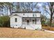 Charming two-story home with a welcoming front porch and manicured lawn at 770 Waters Sw Dr, Atlanta, GA 30310