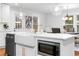 Bright kitchen with large island, farmhouse sink, and stainless steel microwave at 770 Waters Sw Dr, Atlanta, GA 30310