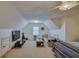 Bonus room featuring a ceiling fan, neutral carpet, window and a tv at 832 Chalet Hls, Mcdonough, GA 30253