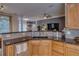 Kitchen featuring granite countertops, stainless steel appliances, wooden cabinets, and tile backsplash at 832 Chalet Hls, Mcdonough, GA 30253