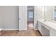 Bathroom view showcasing a vanity with marble countertops and an open door at 1070 Thornwood Cir, Covington, GA 30016