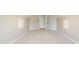 Bedroom with neutral walls, carpet, small window, and storage on either side of the wall at 1070 Thornwood Cir, Covington, GA 30016