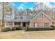 Charming brick home with a covered front porch and well-manicured landscaping at 1070 Thornwood Cir, Covington, GA 30016