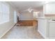 Open floor plan with the kitchen flowing into a living room area with hardwood flooring at 1070 Thornwood Cir, Covington, GA 30016
