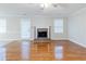 Bright and airy living room with hardwood floors and a cozy fireplace at 1070 Thornwood Cir, Covington, GA 30016