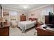 Cozy bedroom featuring neutral tones, natural light, and comfortable furnishings at 1745 Pierce Arrow Pkwy, Tucker, GA 30084