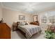 Inviting bedroom with striped bedding, natural light, and comfortable furniture at 1745 Pierce Arrow Pkwy, Tucker, GA 30084