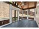 Screened-in porch featuring vaulted ceiling, paneled walls, and an open view at 4590 Wollaston Road, Cumming, GA 30041