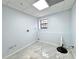 Finished basement with gray floors and utility connections, ready for a laundry or utility space at 6553 Meadowbrook Ln, Morrow, GA 30260