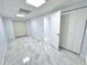 Basement area with elegant gray flooring, offering versatility for storage, play area, or a home office at 6553 Meadowbrook Ln, Morrow, GA 30260