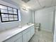 Basement bathroom featuring gray flooring, a modern vanity, and a toilet at 6553 Meadowbrook Ln, Morrow, GA 30260