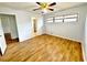 Bedroom featuring hardwood floors, a ceiling fan, and a window that offers natural light at 6553 Meadowbrook Ln, Morrow, GA 30260