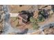 Gorgeous aerial view of the neighborhood home showing the tree-lined streets and manicured lawns at 10950 Glenhurst Pass, Duluth, GA 30097