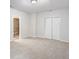 Inviting bedroom with plush carpeting and ample storage with the large double door closet at 10950 Glenhurst Pass, Duluth, GA 30097