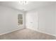 Clean bedroom features neutral carpet, a window, and a closet with double doors at 10950 Glenhurst Pass, Duluth, GA 30097