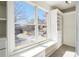 Spacious closet featuring custom built-ins, drawers, shelving, and a window seat with an outdoor view at 10950 Glenhurst Pass, Duluth, GA 30097